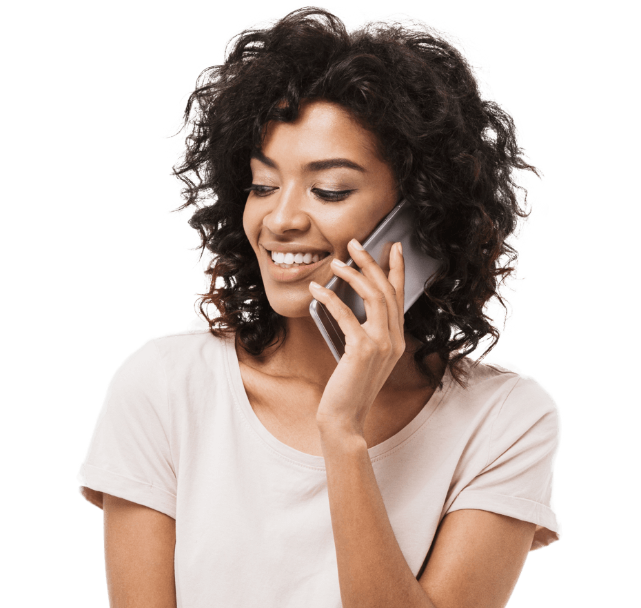 young woman smiling holding a smartphone to her ear