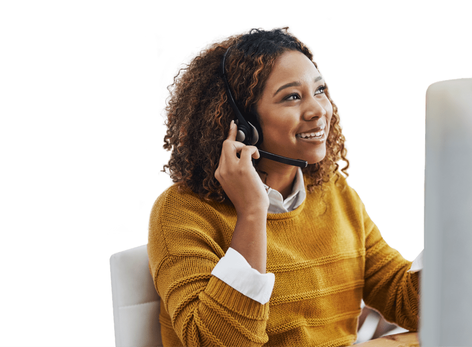 woman with a headset talks in front of computer