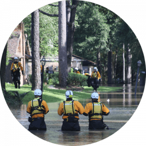 business-telecom-provider-image-Three workers standing in a flooded street