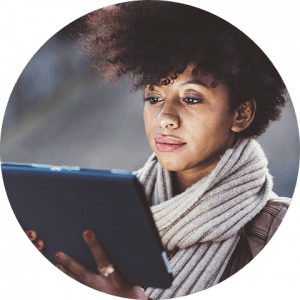 business-telecom-provider-image-African American woman wearing a scarf , looking at an ipad