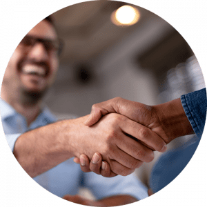 business-telecom-provider-image-Close up of handshake with man smiling in the background