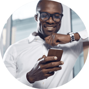 business-telecom-provider-image-Smiling African American man wearing glasses, holding phone in one hand