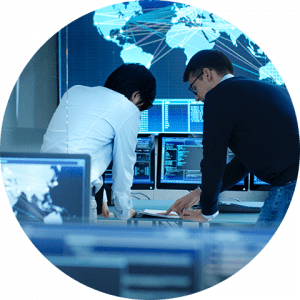 business-telecom-provider-image-Two men in front of computer screens with a global map in the background