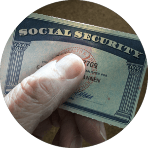 Press - Hand holding social security card
