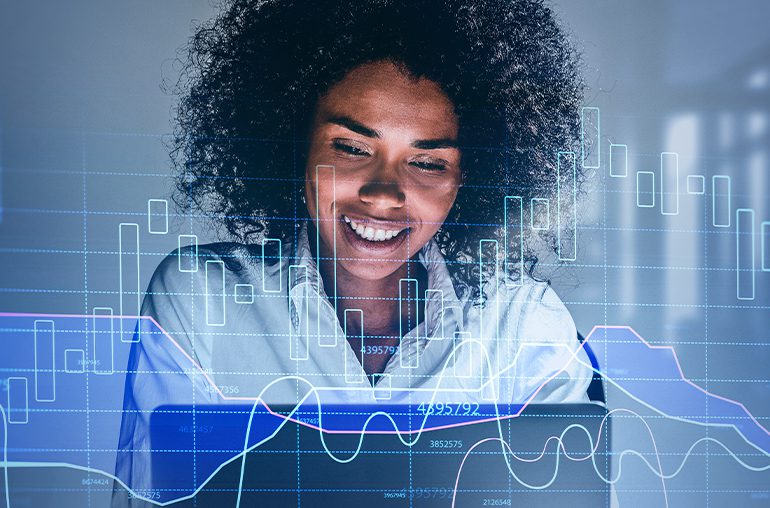 From 5G To AI And Network Security Hot Tech Trend Tips For 2021 - person on laptop with digital trend graphic overlay