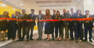 Governor Kathy Hochul, Marshall Aronow, Andoni Economou and others cut ribbon at MetTel's NYC headquarters