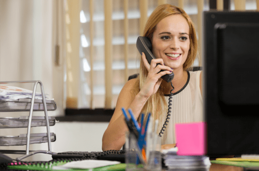 woman talking on phone in office